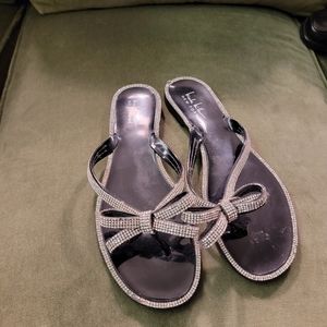 Patent leather flip flops with white rhinestone border and bows